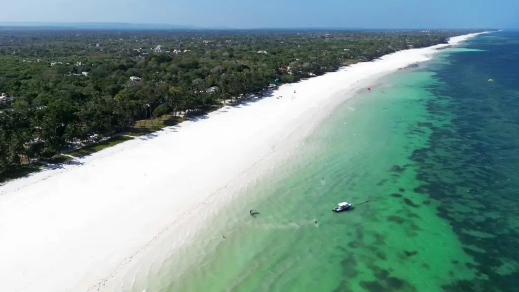 Aerial view of Diani Beach, where white sands meet the turquoise waters of the Indian Ocean